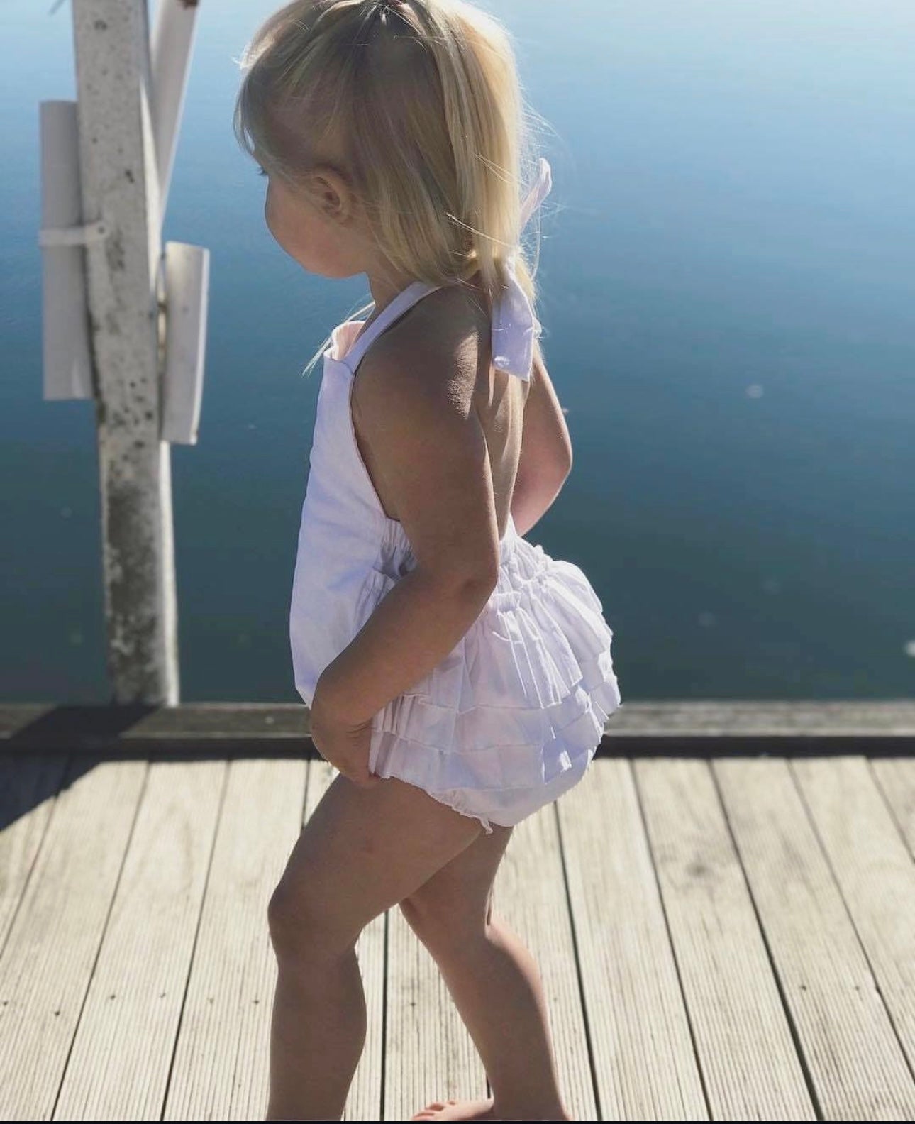 Winnie ruffle bum halter romper